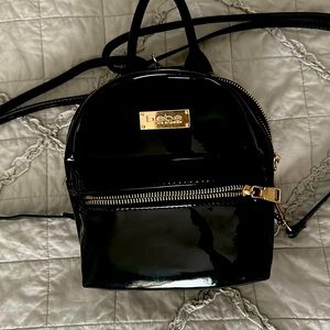 Black patent mini backpack (4th photo for size reference). Excellent condition!